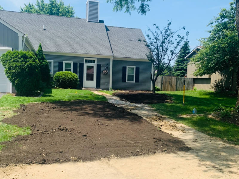 Residential landscaping services on front lawn