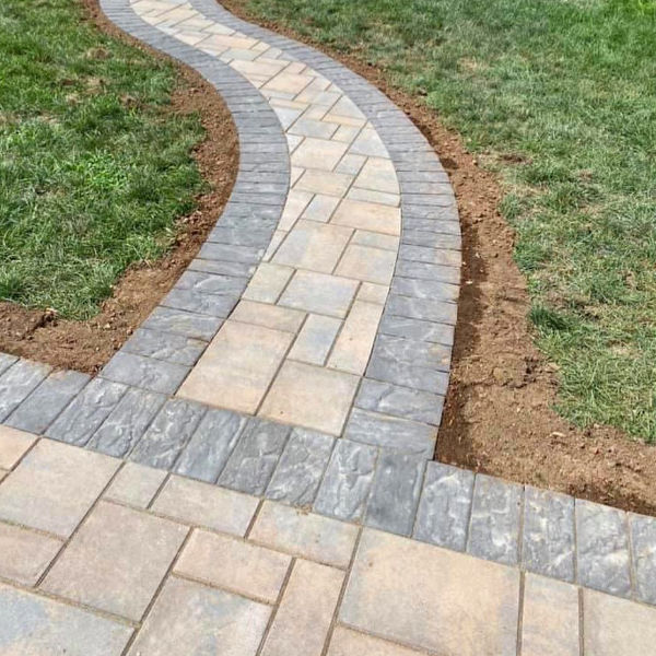 Walkway and patio leading to pool.